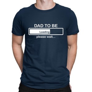 May include: A navy blue t-shirt with the text "DAD TO BE" and a progress bar that says "Loading... please wait..."