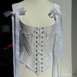 white satin jacquard renaissance corset with lace up front and back, structured overbust bodice with boning and optional straps