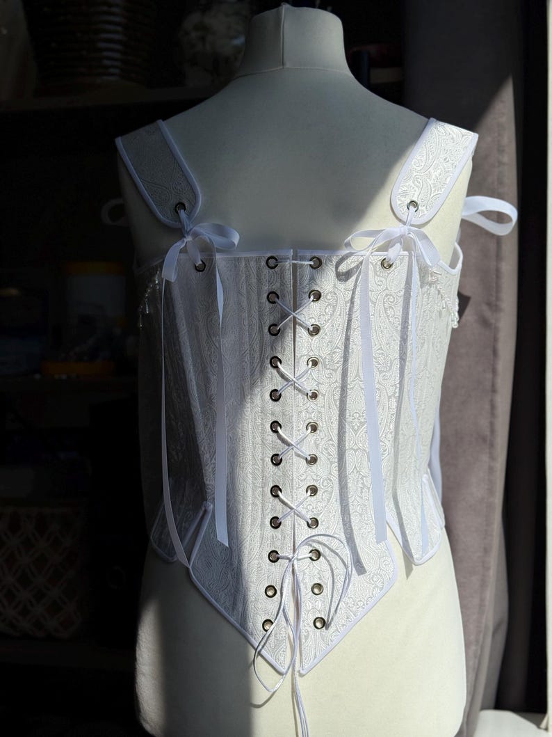 white satin jacquard renaissance corset with lace up front and back, structured overbust bodice with boning and optional straps