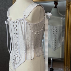 white satin jacquard renaissance corset with lace up front and back, structured overbust bodice with boning and optional straps