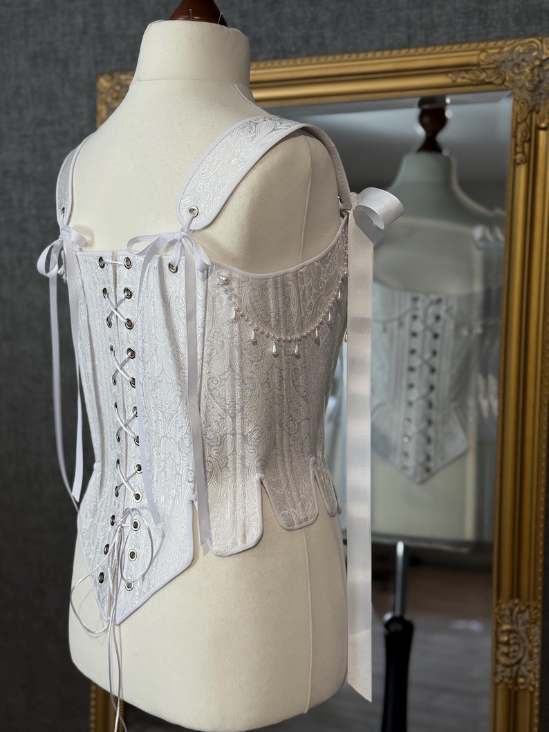 white satin jacquard renaissance corset with lace up front and back, structured overbust bodice with boning and optional straps