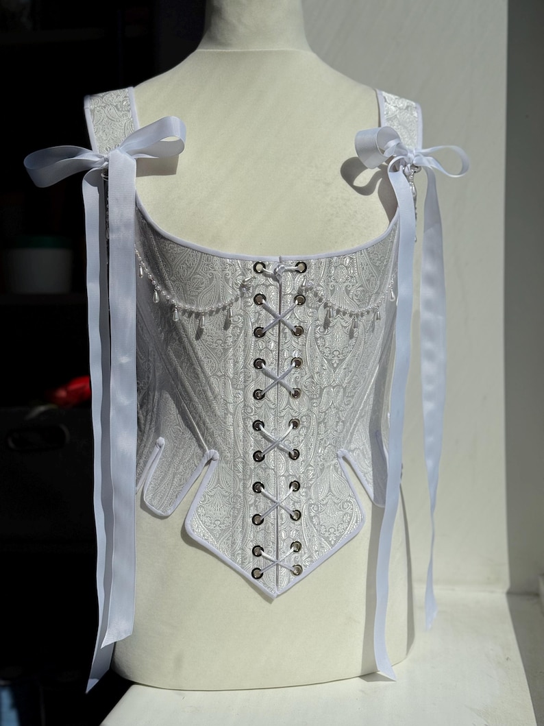 white satin jacquard renaissance corset with lace up front and back, structured overbust bodice with boning and optional straps