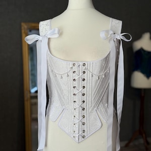 white satin jacquard renaissance corset with lace up front and back, structured overbust bodice with boning and optional straps