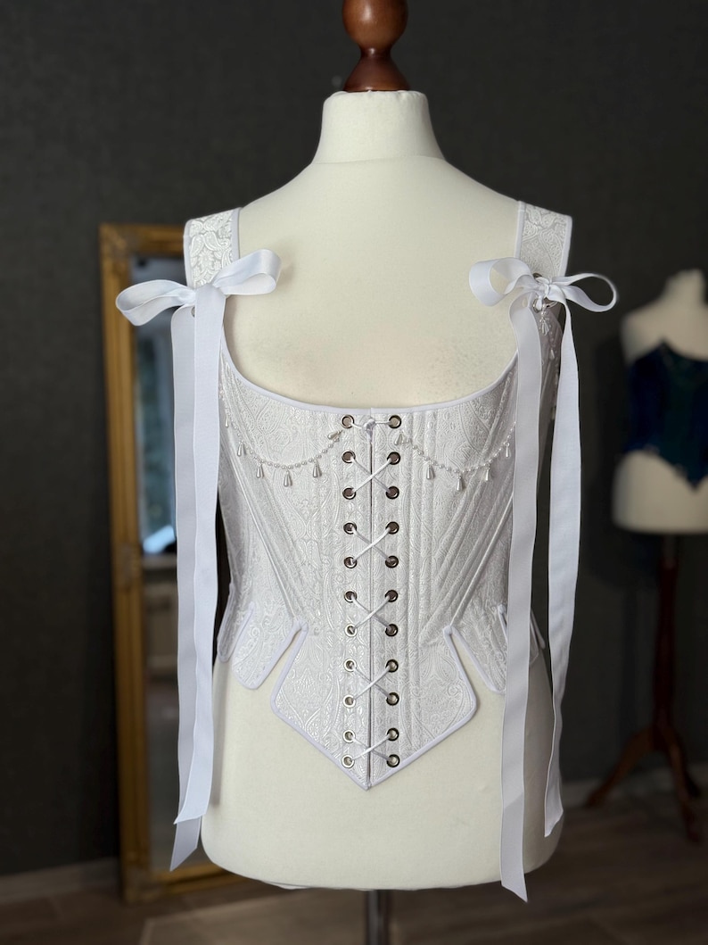 white satin jacquard renaissance corset with lace up front and back, structured overbust bodice with boning and optional straps