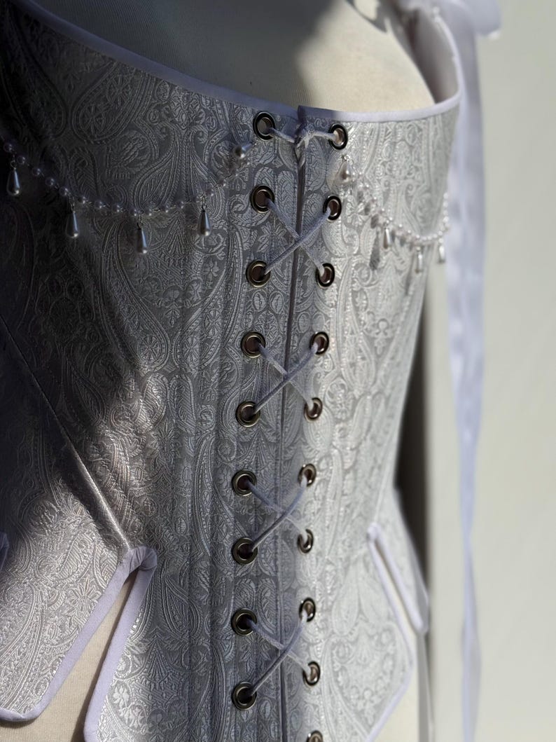 white satin jacquard renaissance corset with lace up front and back, structured overbust bodice with boning and optional straps