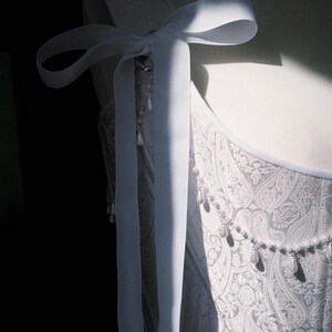 white satin jacquard renaissance corset with lace up front and back, structured overbust bodice with boning and optional straps