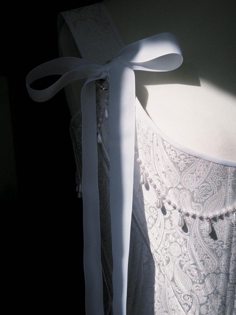 white satin jacquard renaissance corset with lace up front and back, structured overbust bodice with boning and optional straps