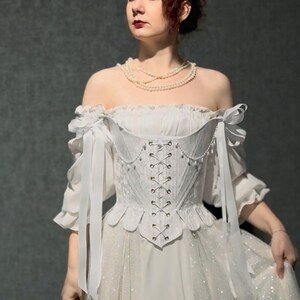 white satin jacquard renaissance corset with lace up front and back, structured overbust bodice with boning and optional straps