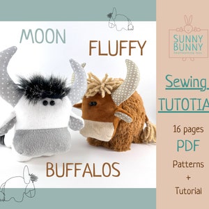 May include: A sewing pattern for two plush buffalo toys, one white with black fur and one brown with white spots. The pattern includes 16 pages of instructions and is available as a PDF download. The pattern is titled "Moon Fluffy Buffaloes" and is from the shop "Sunny Bunny Heartwarming Toys".