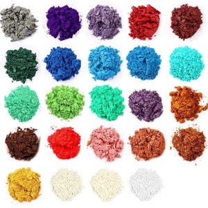 May include: Assortment of 25 vibrant pigment powder colors in small piles on a white background. The colors include red, orange, yellow, green, blue, purple, brown, black, and white.