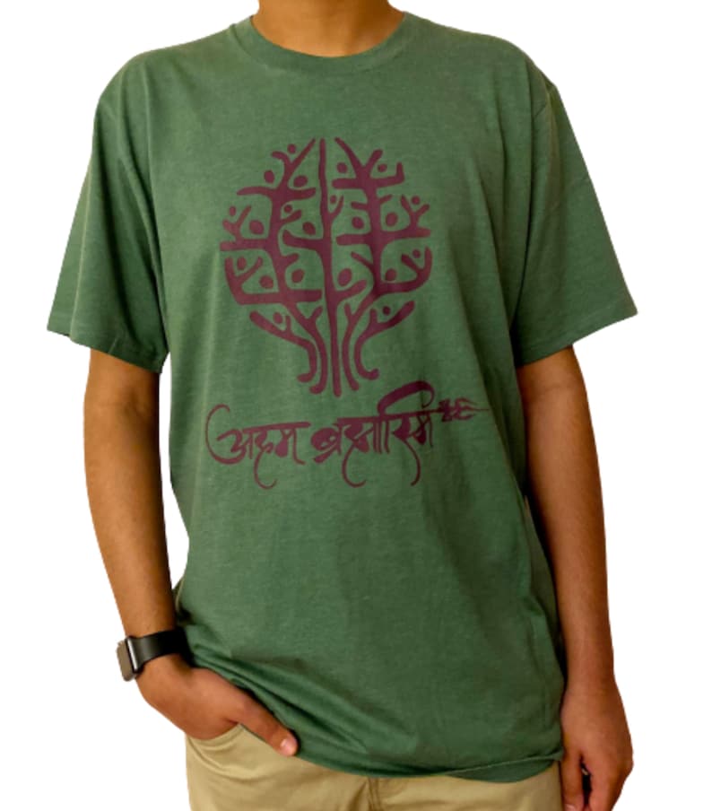 May include: A green t-shirt with a burgundy tree design and the text "अक्षम अक्षरासि" in burgundy.