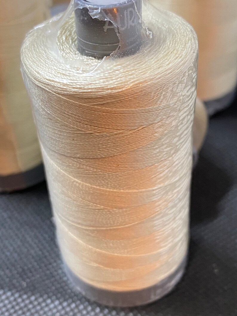 goldish cream Aurifil #2310 28 weight thread.