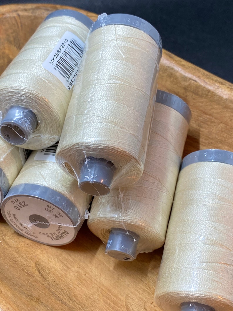 goldish cream Aurifil #2310 28 weight thread.