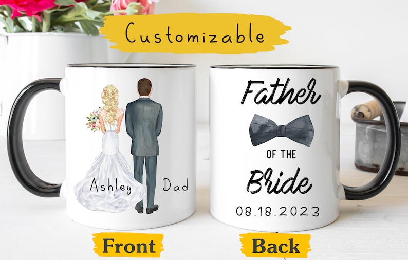 May include: White ceramic mug with a black handle. The front of the mug features a watercolor illustration of a bride and groom with the text "Ashley Dad". The back of the mug features the text "Father of the Bride" with a black bow tie and the date "08.18.2023".