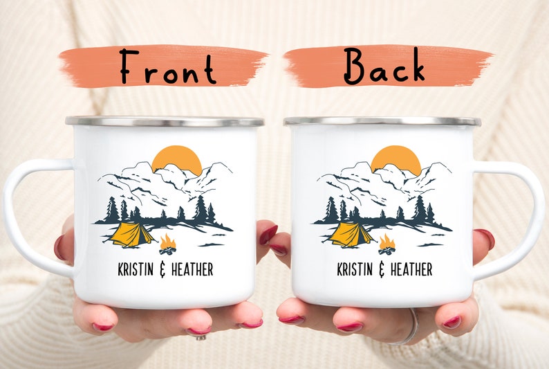 May include: Two white enamel camping mugs with a mountain scene and a yellow tent. The text "Kristin & Heather" is printed on the front of each mug.