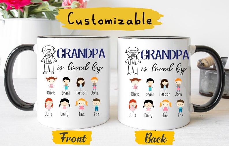 May include: White ceramic mug with a black handle. The mug has a black outline and the text "GRANDPA is loved by" in blue. Below the text are drawings of children with names underneath. The back of the mug has the same design.
