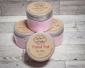 May include: Three jars of pink body butter labeled "Tropical Fruit" with a brown and white label. The label includes the text "Jess You Creations" and the website address "www.jess4youcreationshop.etsy.com".