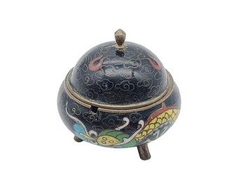 Vintage round enamel brass trinket box, pill box, ring box with lid. Dragon design on black background, 1 3/4" diameter x 1 7/8" tall.