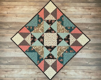 Estrella expandible acolchada para mesa o tapiz, 24" cuadrados