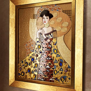May include: A framed painting of a woman in a gold and brown dress with a geometric pattern. The woman is wearing a crown and has a gold background.