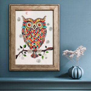 May include: A colorful stained glass owl with intricate details sits on a branch with green leaves. The owl is surrounded by swirls and dots on a white background. The artwork is framed in a light brown wood frame.