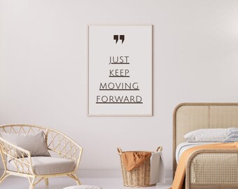 May include: A framed print with the text "JUST KEEP MOVING FORWARD" in a minimalist style. The print is displayed in a light-colored room with a woven chair, a basket, and a bed frame.