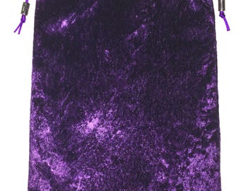 May include: A purple velvet drawstring bag with a silver metal toggle.