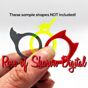May include: Three plastic rings in different colors and shapes. The rings are gray, yellow, and red. The text "Rose of Sharon Digital" is visible in the image.