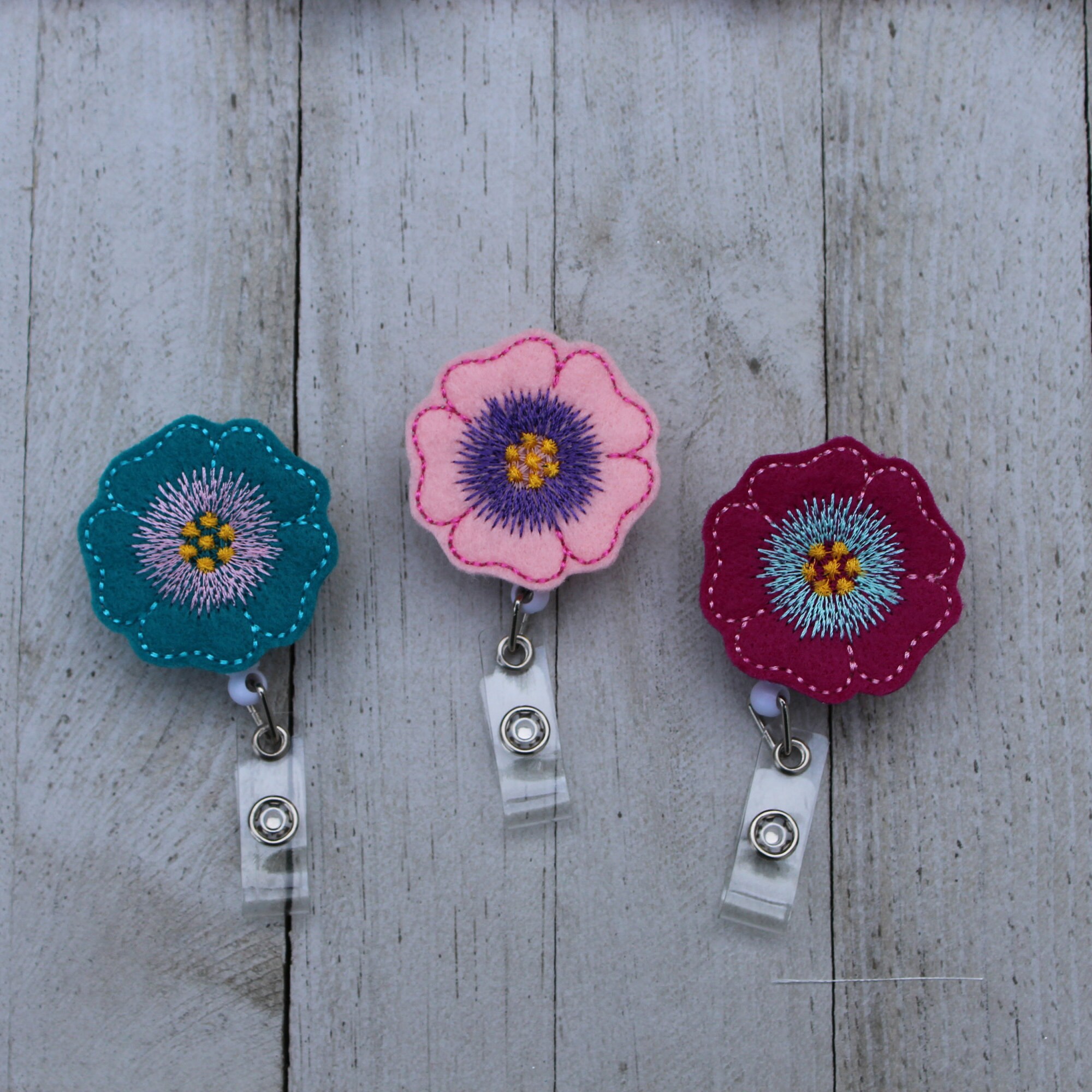 Flower retractable ID badge holder.