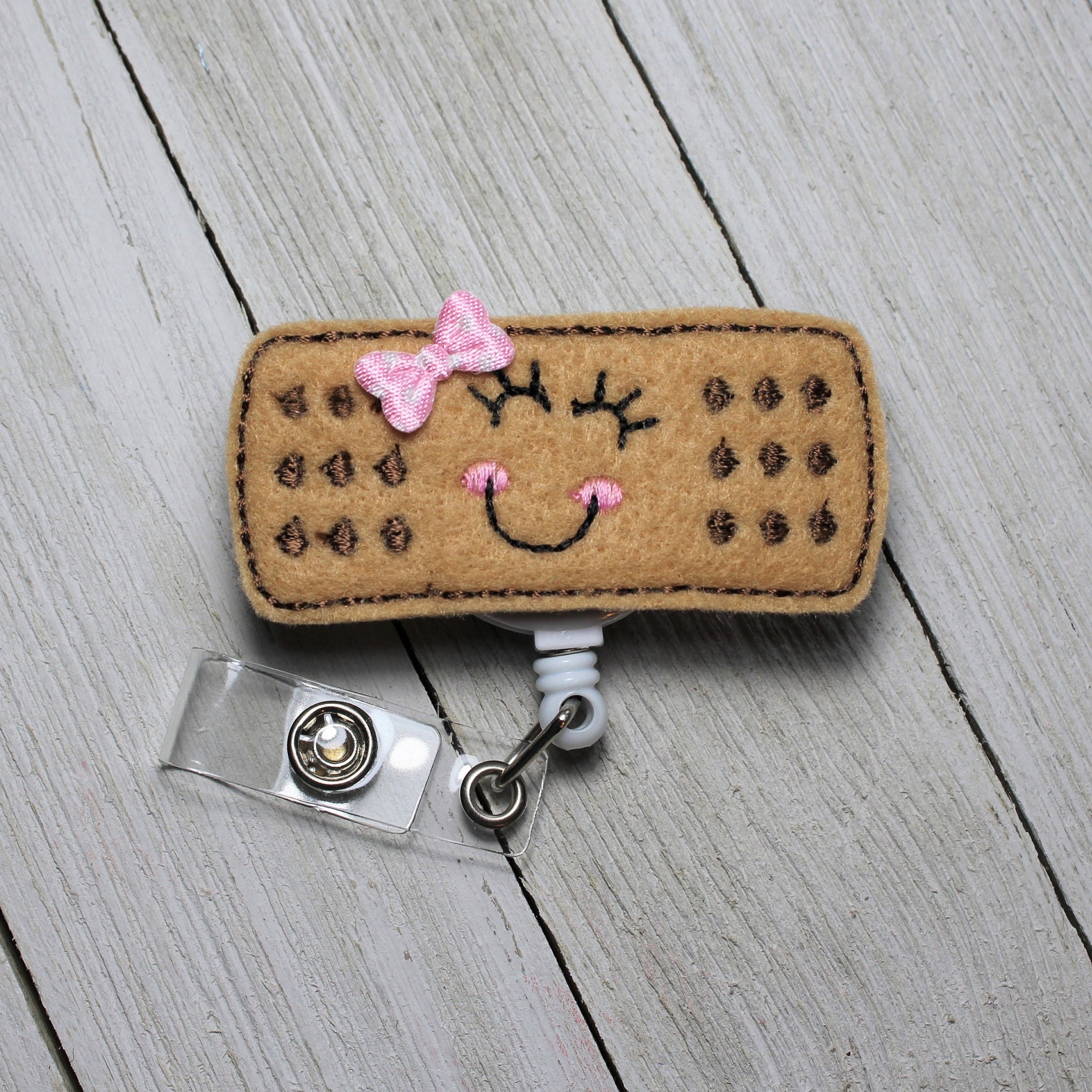 Happy Bandaid badge holder with retractable reel