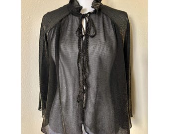 Blusa vintage transparente negra y dorada de los años 70