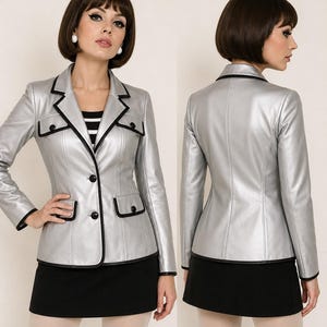 10 12 Silberne PVC-Jacke – Schwarzer Besatz, Mod-Stil der 1960er Jahre