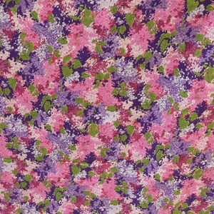 May include: A fabric with a floral pattern featuring pink, purple, and green flowers. The flowers are clustered together and create a busy, colourful design.