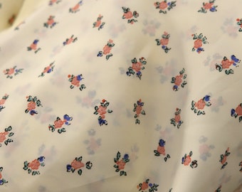 1970's  vintage light polyester ivory fabric with small feminine girlish print 44"  wide by 116" in length blouse or slip weight slippery
