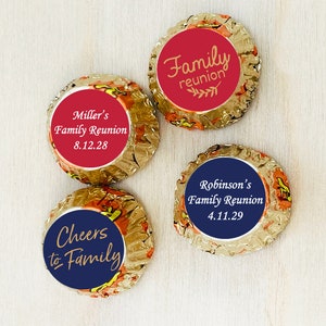 May include: Four round chocolate candies wrapped in gold foil, each topped with a circular sticker. Two stickers are red with gold text reading Family reunion, Miller's Family Reunion 8.12.28. Two are navy blue with text Robinson's Family Reunion 4.11.29 and Cheers to Family.