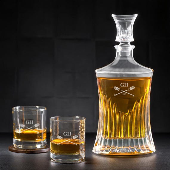 A rowing-themed engraved whiskey decanter set — niche sport personalization elevates this above the generic decanter crowd.