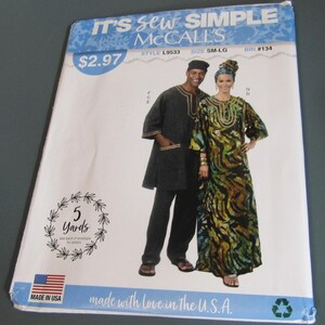May include: A McCall's sewing pattern envelope labeled IT'S SEW SIMPLE, style L9533, size SM-LG. The front displays a photograph of two individuals wearing matching black and multi-colored patterned garments, including a tunic, pants, and a headwrap.