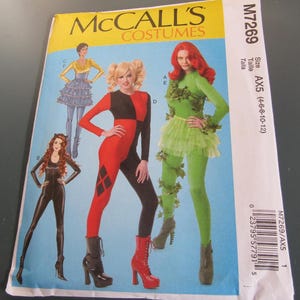 May include: McCall's Costumes pattern M7269 featuring illustrations of various costumes. The costumes include a black catsuit, a red and black jumpsuit with diamond accents, a green ivy-themed outfit, and a yellow and blue outfit. Size AX5 (4-6-8-10-12).