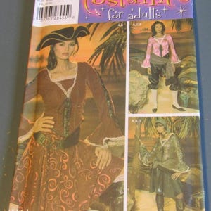 May include: A sewing pattern for a pirate costume. The pattern includes instructions for making a blouse, skirt, and pants. The pattern is for sizes 14-22. The pattern is from Simplicity.