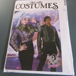 May include: McCall's Costumes pattern featuring two models in stylish outfits. The cover displays the text "COSTUMES" and "M8188". The models are wearing a jacket and a black outfit. The pattern is available in sizes A (XS-XL/S-XL).