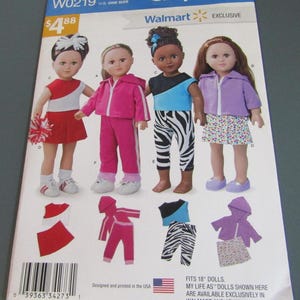 May include: A Simplicity W0219 sewing pattern envelope for 18-inch dolls. The front displays four dolls wearing different outfits: a red and white cheerleader uniform, a pink tracksuit, a blue and black top with zebra print leggings, and a purple hoodie with a heart-patterned skirt. Illustrations of the clothing pieces are shown below the dolls.