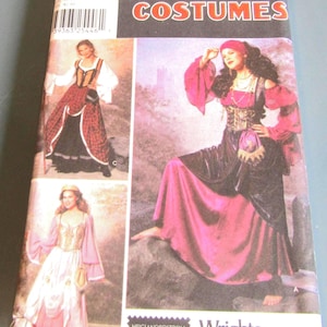 May include: Simplicity Costumes sewing pattern number 966 for a pirate costume. The pattern includes three different costume options: a red and black costume, a pink and black costume, and a white and gold costume. The pattern is for sizes 14, 16, 18, and 20.
