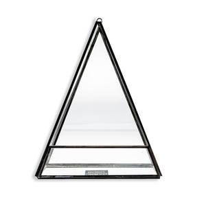 May include: A black metal and glass terrarium in a triangular shape. The terrarium has a small shelf and a loop at the top for hanging. The glass panels are clear, and the frame is black.