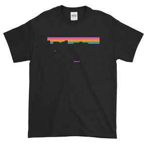 May include: Black t-shirt with a pixelated rainbow graphic of a video game character. The graphic is in the center of the shirt.