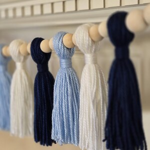 Handmade tassel banner in Carolina blue and white for North Carolina–inspired college parties, tailgates, and alumni events.