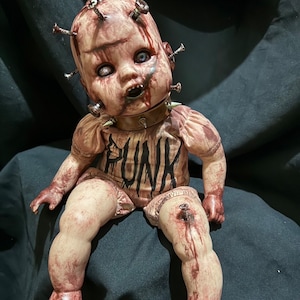 Bestseller! Punk doll decorated with knot heads. Size 14” style realistic and scary, For homedeco gift idea.