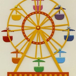 Könnte beinhalten: Ein gelbes Riesenrad mit acht bunten Gondeln, jede mit einem weißen Sonnenschirm. Das Riesenrad hat eine rote Basis mit gelben Punkten und den Text "LASER CUT" in rot.