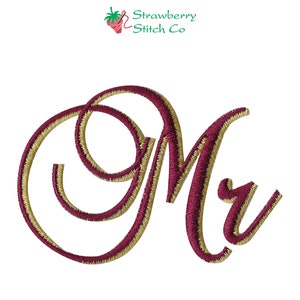May include: Embroidered monogram initial "M" in a cursive script style. The letter is outlined in gold thread and filled in with burgundy thread.