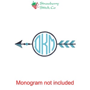 May include: A blue and black arrow with a circle in the center. The circle has the letters "OKM" inside. The text "Monogram not included" is below the arrow.