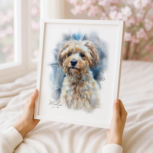 May include: A framed watercolor portrait of a small, fluffy dog with tan and cream-colored fur. The dog has a focused expression, and the background features blue and white watercolor washes. The name "Merlin" is written in cursive at the bottom.